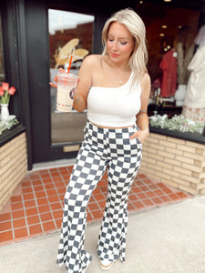 Walk it like it’s hot checkered flare pants