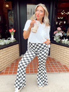 Walk it like it’s hot checkered flare pants