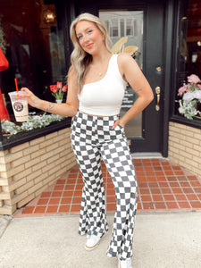 Walk it like it’s hot checkered flare pants