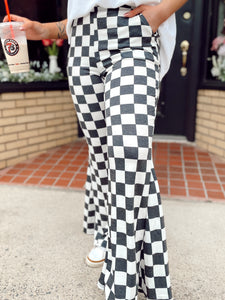 Walk it like it’s hot checkered flare pants