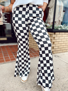 Walk it like it’s hot checkered flare pants