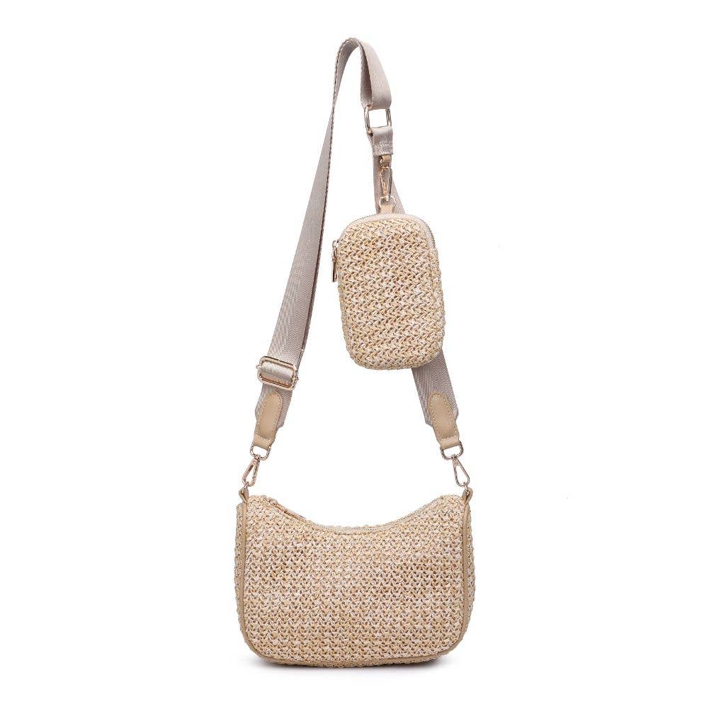 The Joss Crossbody is a woven straw bag with a beige adjustable strap and a small matching pouch—perfect for stylish everyday outings.